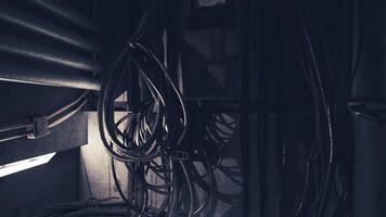 CGI Dark corners of a technical space with tangled cables and shadows video