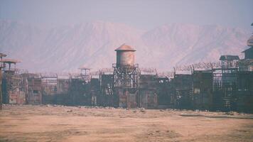 CGI Abandoned settlement with barbed wire and rusted structures near mountains video