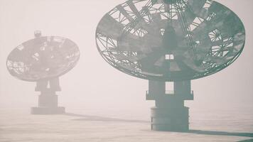 CGI Foggy landscape with large satellite dishes overlooking vast terrain video