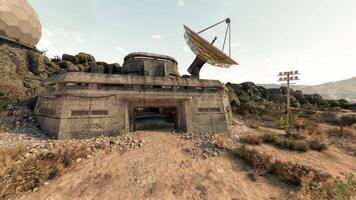 CGI Abandoned communication facility nestled in rugged landscape under clear skies video