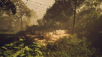 CGI Outdoor dining setup in a lush garden with string lights at dusk video