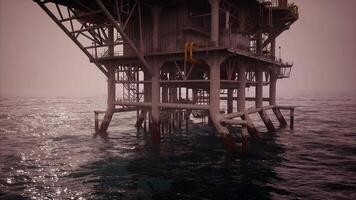 CGI Oil rig standing strong in deep water during hazy twilight conditions video