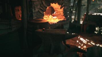 CGI Crafting metal at an old forge with glowing embers and tools video