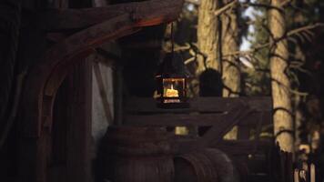 CGI Warm lantern illuminates rustic setting in a tranquil forest video