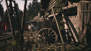 CGI Abandoned wooden structure with wagon wheel in rustic setting video