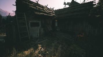 CGI Old rustic structures in a mountainous area during golden hour light video