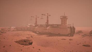 CGI Mars colony under dusty atmosphere with structures and machinery operational video
