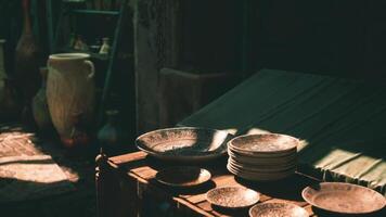 CGI Collectible pottery displayed on a wooden table in a marketplace setting video