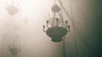 CGI Chandeliers illuminated by soft light in a misty environment video