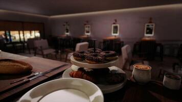 CGI Desserts and pastries displayed on a tiered stand in a cozy cafe setting video