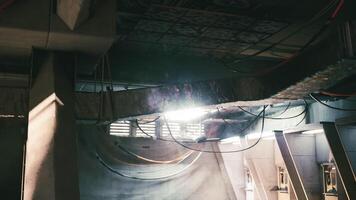 CGI Industrial underground space with wires and sunlight filtering through video