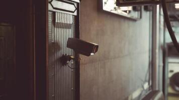 CGI Surveillance camera mounted on wall in an urban environment for security video