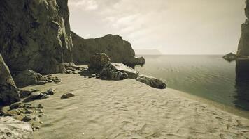 CGI Tranquil beach at dusk with rocky cliffs and calm waters in the background video