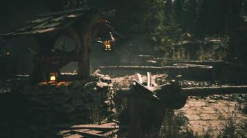 CGI Rustic well with lanterns surrounded by trees in a serene landscape setting video