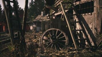 CGI Rustic wooden wheel and structures in an overgrown old village setting video