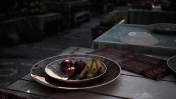 CGI Fruits arranged on decorative plates in an outdoor marketplace setting video