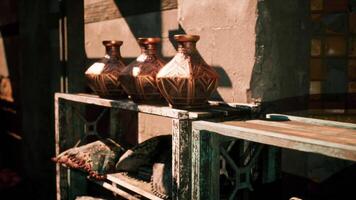 CGI Handcrafted pottery displayed on a rustic shelf in a sunlit setting video