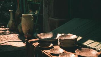 CGI Decorative pottery on display in a sunlit market stall in the afternoon video