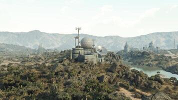 CGI Remote communication facility on rocky terrain near a river in daylight video