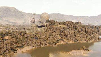 CGI Remote outpost with communication dishes situated by a tranquil lakeside video