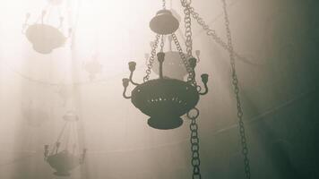 CGI Elegant chandeliers illuminate a misty atmosphere in a historic setting video