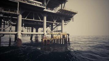 CGI Oil rig stands tall against the waves in an offshore location at dusk video