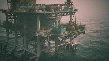 CGI Offshore oil rig operating over calm seas at dusk during the evening hours video