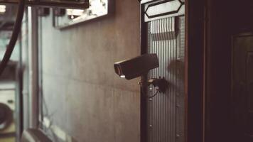 CGI Security camera mounted on wall in urban environment during daytime video