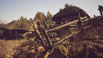CGI Rustic village with thatched roofs and wooden fences in natural setting video