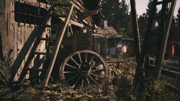 CGI Rustic old wagon wheel beside wooden structures in outdoor setting video