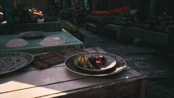 CGI Colorful fruit arrangement on a plate at a market in the afternoon light video