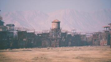 CGI Dry desert wasteland with a rusty water tower near a barbed wire fence video