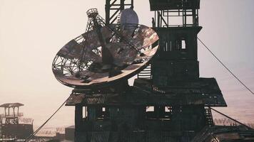 CGI Abandoned structure with satellite dish overlooking a distant landscape video