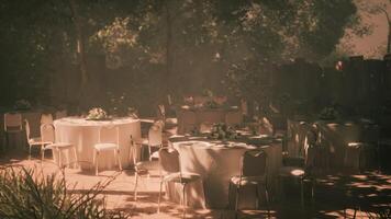 CGI Outdoor event setting with tables and chairs surrounded by nature video