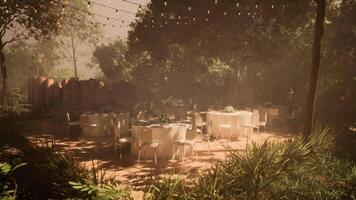CGI Outdoor dining setup with elegant tables in a tranquil garden setting video