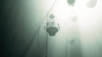 CGI Mysterious chandeliers hanging in a foggy, dimly lit space video