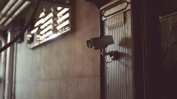 CGI Security camera mounted on urban building capturing activity in the area video