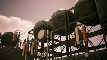 CGI Industrial structures with communication devices against a cloudy sky backdrop video