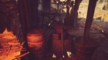 CGI Old forge with wooden barrels and tools under warm firelight video