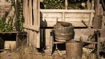 CGI Old wooden structure with buckets and greenery in a rustic setting video