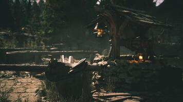 CGI Historic well and lanterns within a rustic fenced forest video