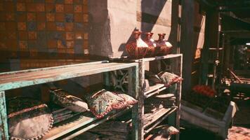 CGI Colorful clay pots and decorative pillows displayed in a market setting video