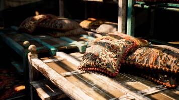 CGI Decorative pillows arranged on rustic wooden shelves in a cozy setting video