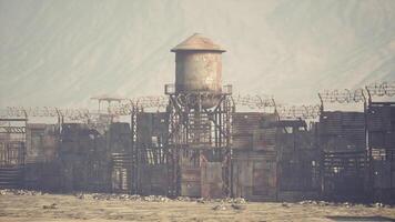 CGI Abandoned water tower beside rusty fences at desolate landscape video