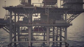 CGI Oil rig structure standing in calm ocean waters during late afternoon video