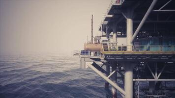 CGI Oil rig surrounded by ocean waves at dawn with misty atmosphere video
