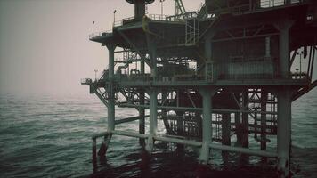 CGI Oil rig rising from the ocean at twilight with misty horizon and calm water video