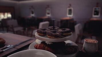 CGI Delicious variety of pastries and coffee in a cozy cafe setting video