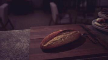 CGI Freshly baked loaf resting on a wooden board in a cozy setting video