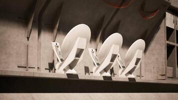 CGI Sleek satellite dishes installed in modern tech facility for signal reception video